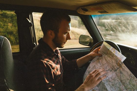 A man is checking a map to see where he goes next