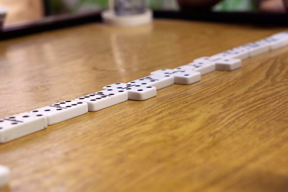 Domino tiles laid out on a wooden table